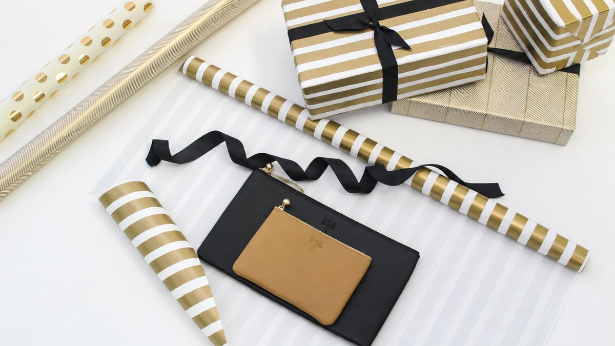 OTG|247 #2 tan and #5 black pouches with gold gift wrap and ribbon