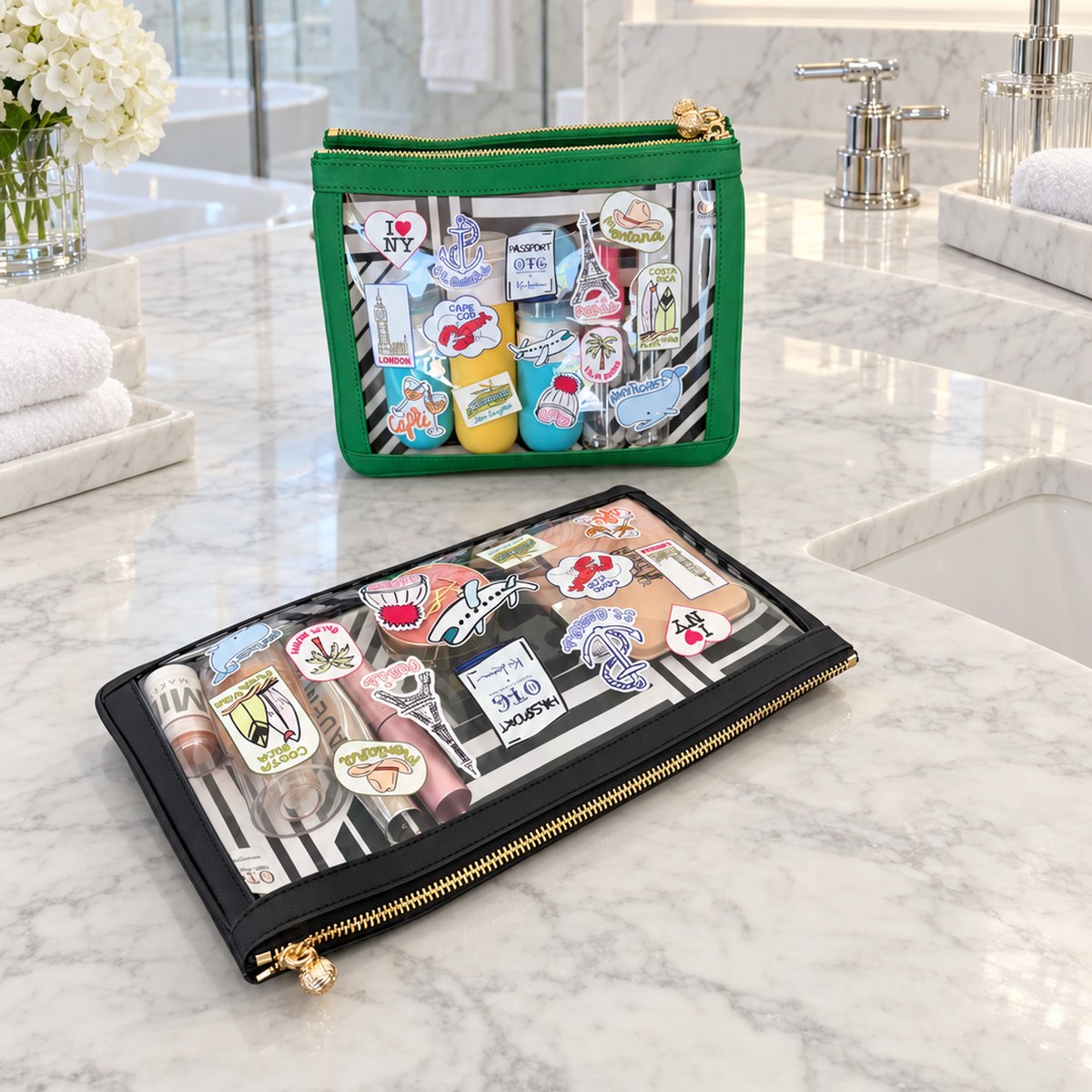 Kai Lassen #4 Nudie Green pouch with toiletries and #5 Nudie Black clutch with makeup on a marble vanity